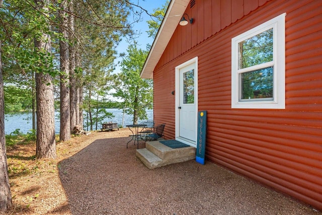9347 Musky Bay Ln, Harshaw, WI 95429 - view of patio with a water view and entry steps