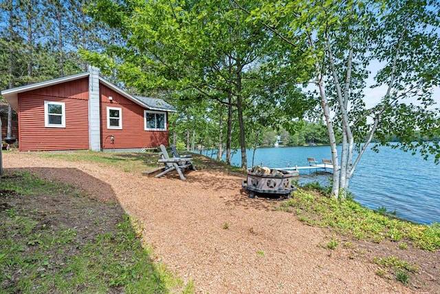 9347 Musky Bay Ln, Harshaw, WI 95429 - view of yard featuring an outdoor fire pit and a water view