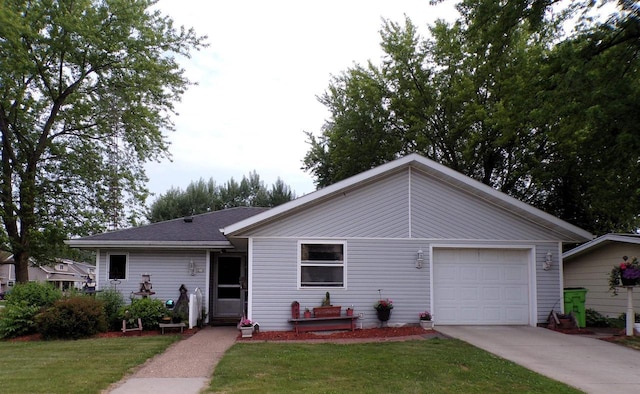 210 W S St, Loyal, WI 54446 - view of front of property featuring driveway, a front yard, and an attached garage