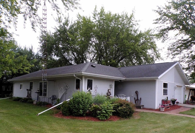 210 W S St, Loyal, WI 54446 - view of side of property with a yard and an attached garage