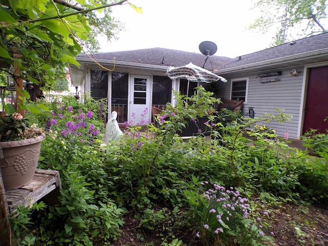 210 W S St, Loyal, WI 54446 - back of property featuring roof with shingles and a sunroom