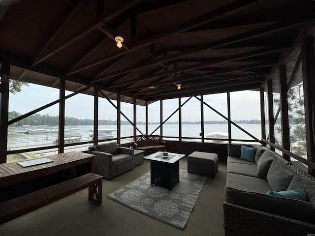 N2817 Rustic Dr, Clintonville, WI 54929 - sunroom featuring an outdoor living space with a fire pit, a water view, and lofted ceiling