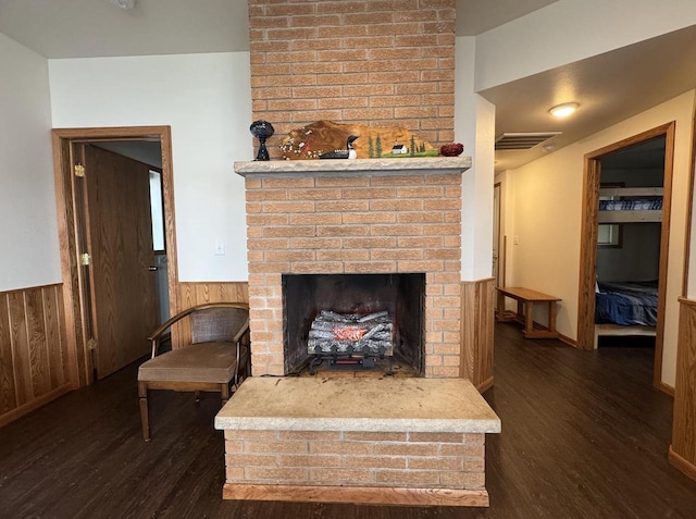 N2817 Rustic Dr, Clintonville, WI 54929 - living area featuring wood finished floors, a wainscoted wall, a fireplace, and wood walls