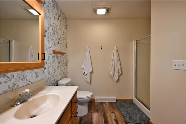 W5342 County Highway F, Trego, WI 54888 - full bathroom with wood finished floors, a shower stall, and vanity