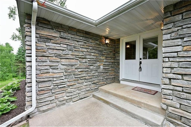 W5342 County Highway F, Trego, WI 54888 - view of exterior entry featuring stone siding