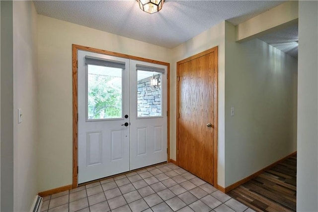 W5342 County Highway F, Trego, WI 54888 - entrance foyer featuring a textured ceiling and french doors