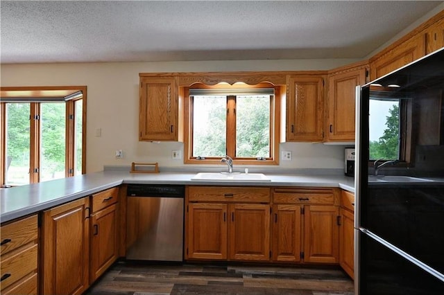 W5342 County Highway F, Trego, WI 54888 - kitchen featuring dishwasher, light countertops, plenty of natural light, and a textured ceiling