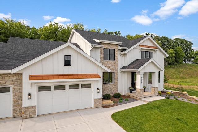 5928 Burning Prairie Dr, Waunakee, WI 53597 - modern farmhouse with stone siding, roof with shingles, and board and batten siding