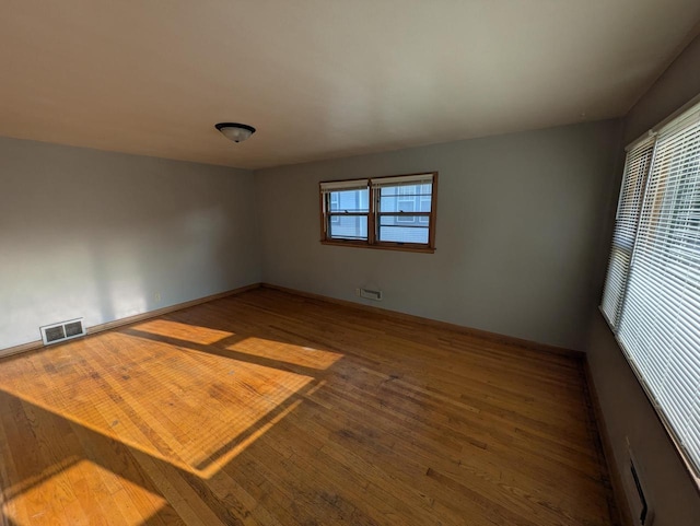 2759 N 57th St Unit 2761, Milwaukee, WI 53210 - unfurnished room with wood finished floors and baseboards
