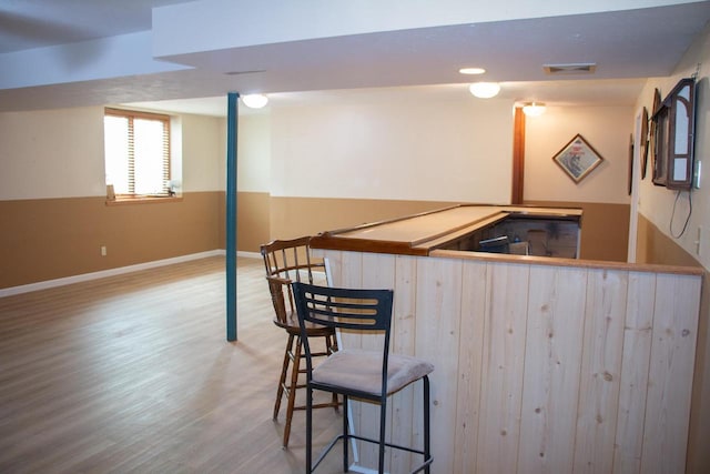 4303 E Milwaukee St Unit B, Janesville, WI 53546 - indoor bar featuring wood finished floors and baseboards