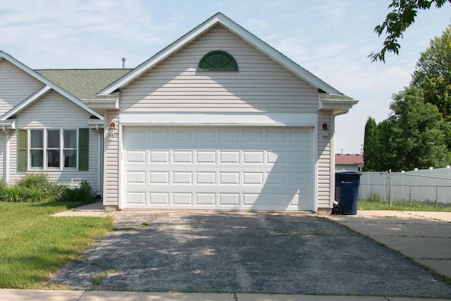 4303 E Milwaukee St Unit B, Janesville, WI 53546 - view of front of home with asphalt driveway and a garage