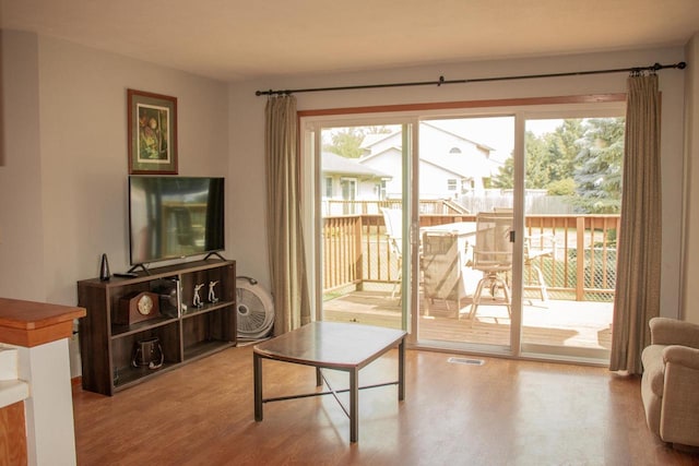 4303 E Milwaukee St Unit B, Janesville, WI 53546 - living area featuring wood finished floors and plenty of natural light