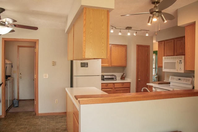 4303 E Milwaukee St Unit B, Janesville, WI 53546 - kitchen with white appliances, ceiling fan, a peninsula, washer and dryer, and light countertops