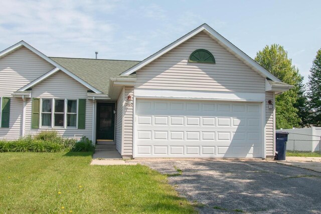 4303 E Milwaukee St Unit B, Janesville, WI 53546 - ranch-style house with an attached garage, asphalt driveway, and roof with shingles