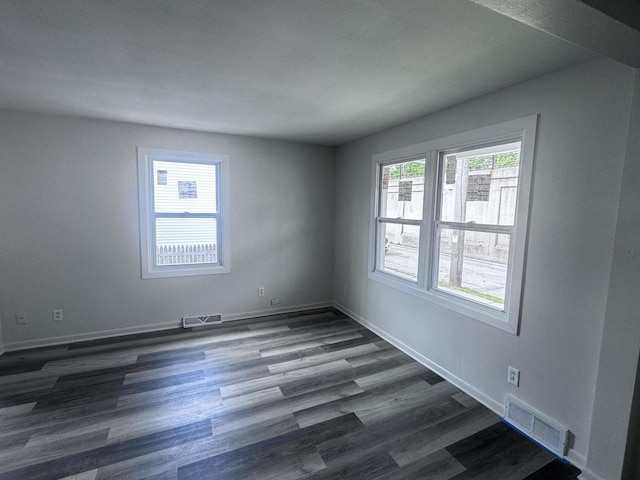 6337 13th Ave, Kenosha, WI 53143 - spare room with dark wood-style flooring
