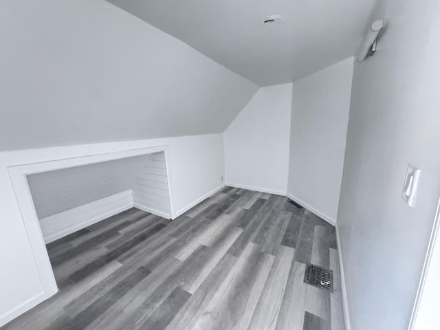 6337 13th Ave, Kenosha, WI 53143 - bonus room featuring dark wood-style floors and vaulted ceiling