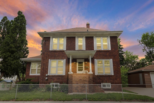 7732 15th Ave, Kenosha, WI 53143 - view of front of property with brick siding, a chimney, and a fenced front yard