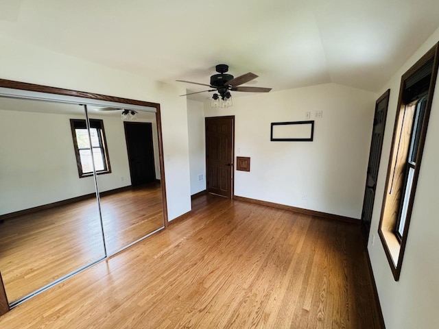 3441 N 55th St, Milwaukee, WI 53216 - unfurnished bedroom featuring vaulted ceiling, light wood-type flooring, a closet, and ceiling fan