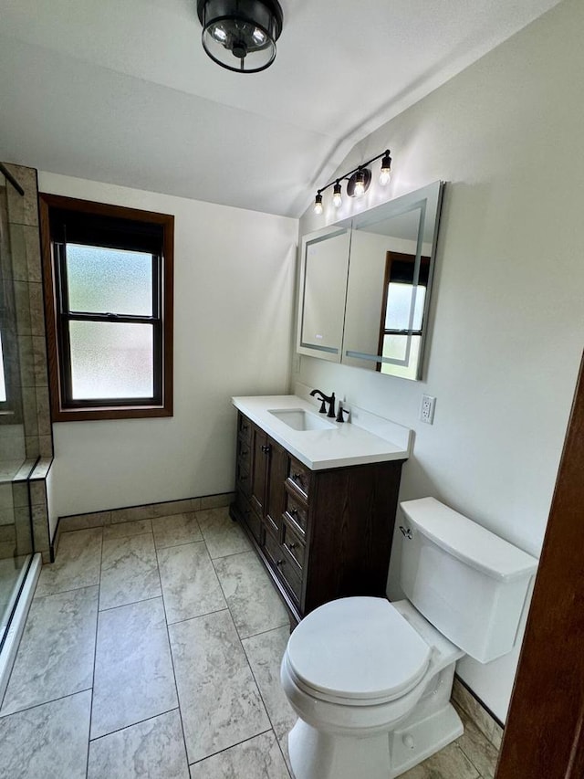 3441 N 55th St, Milwaukee, WI 53216 - bathroom with a tile shower, lofted ceiling, vanity, healthy amount of natural light, and marble finish flooring