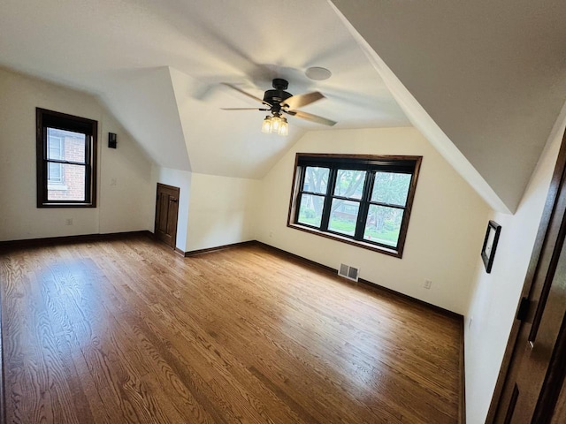 3441 N 55th St, Milwaukee, WI 53216 - bonus room featuring wood finished floors, lofted ceiling, and a ceiling fan
