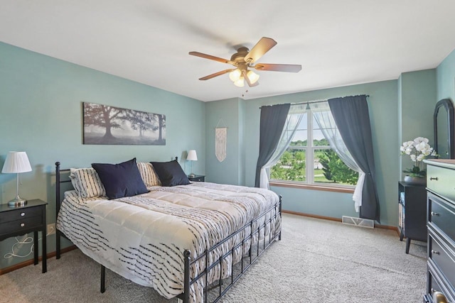 7042 Littlemore Dr, Madison, WI 53718 - carpeted bedroom featuring baseboards and ceiling fan