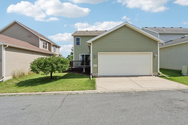 7042 Littlemore Dr, Madison, WI 53718 - traditional-style house featuring concrete driveway, a front lawn, and a garage