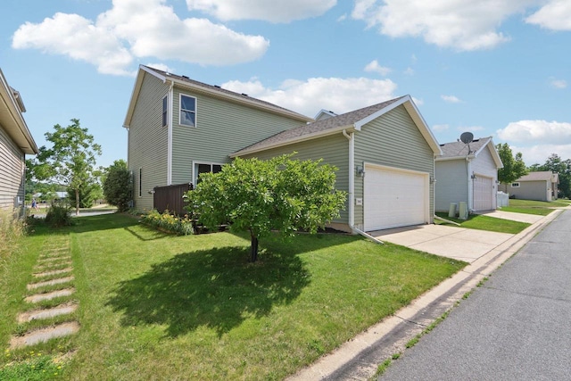 7042 Littlemore Dr, Madison, WI 53718 - view of side of home with an attached garage, concrete driveway, and a yard