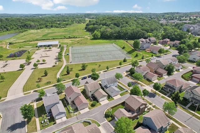 7042 Littlemore Dr, Madison, WI 53718 - aerial view of residential area featuring a nearby body of water and a heavily wooded area