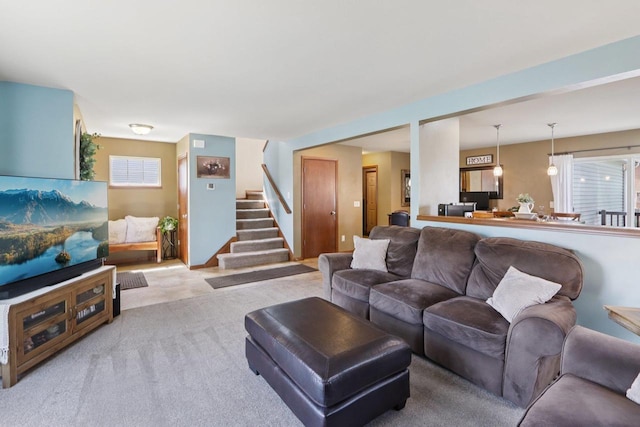 7042 Littlemore Dr, Madison, WI 53718 - carpeted living room featuring stairway
