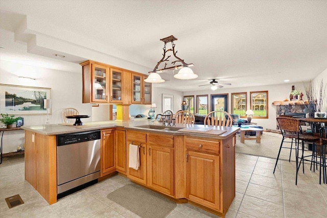 1848-2 E 20th Ct Unit 2402, Arkdale, WI 54613 - kitchen with stainless steel dishwasher, a peninsula, open floor plan, a ceiling fan, and brown cabinets