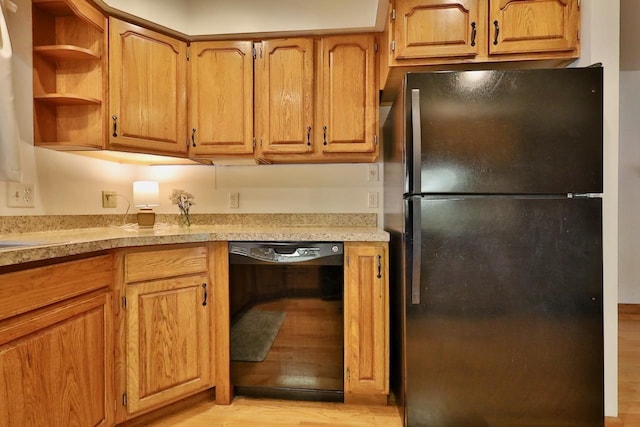 2413 Ravenswood Rd, Madison, WI 53711 - kitchen with black appliances, light wood-style flooring, light countertops, and open shelves