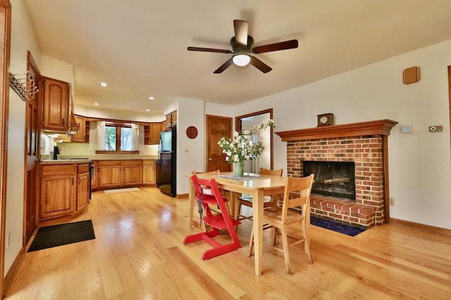 2413 Ravenswood Rd, Madison, WI 53711 - dining room featuring light wood-type flooring, a fireplace, ceiling fan, and recessed lighting