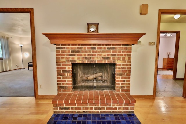 2413 Ravenswood Rd, Madison, WI 53711 - detailed view of wood finished floors and a fireplace