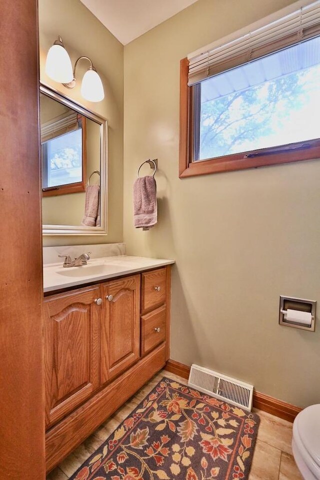 2413 Ravenswood Rd, Madison, WI 53711 - bathroom with baseboards and vanity