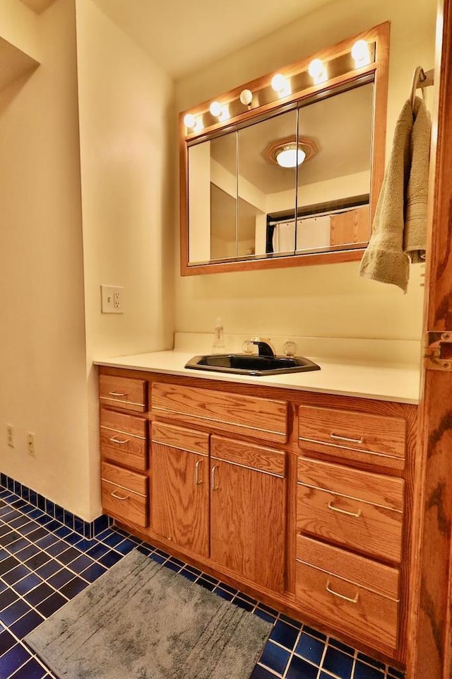 2413 Ravenswood Rd, Madison, WI 53711 - bathroom with tile patterned floors and vanity
