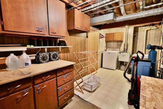 2413 Ravenswood Rd, Madison, WI 53711 - basement with washer / dryer and wood walls