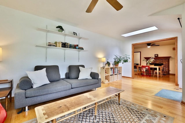 2413 Ravenswood Rd, Madison, WI 53711 - living area featuring a ceiling fan, light wood-style flooring, and a skylight