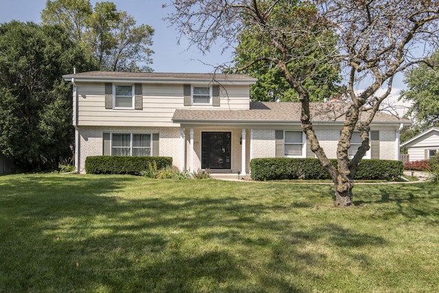 8725 N Fielding Rd, Bayside, WI 53217 - traditional home with brick siding and a front lawn