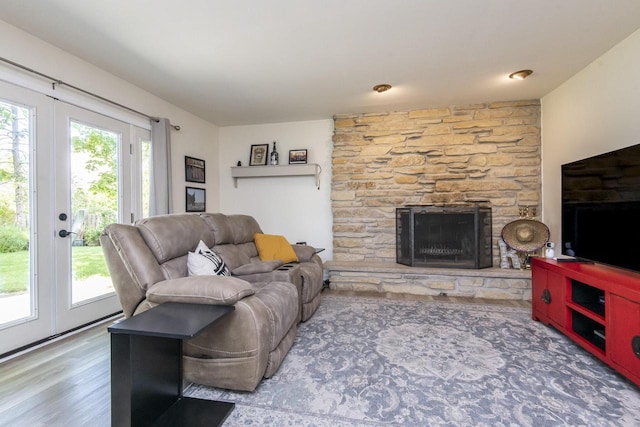 8725 N Fielding Rd, Bayside, WI 53217 - living room featuring a stone fireplace, wood finished floors, and french doors