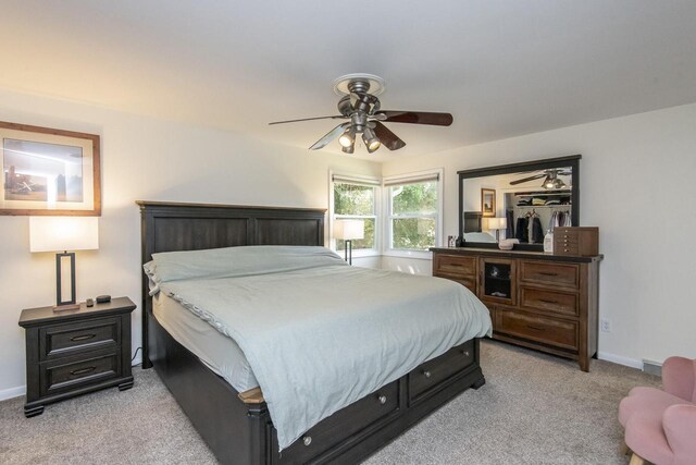 8725 N Fielding Rd, Bayside, WI 53217 - bedroom with light colored carpet and ceiling fan