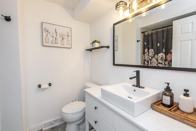 8725 N Fielding Rd, Bayside, WI 53217 - bathroom with vanity and toilet
