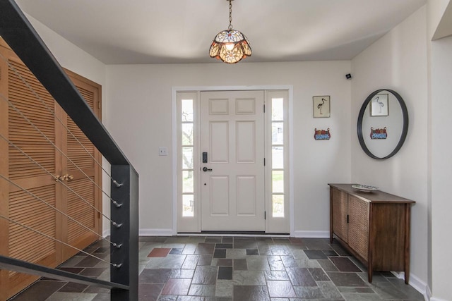 8725 N Fielding Rd, Bayside, WI 53217 - foyer with healthy amount of natural light and stone tile floors