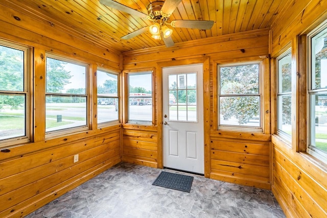 2941 Plover Rd, Wisconsin Rapids, WI 54494 - unfurnished sunroom with wooden walls, stone finish floors, and wood ceiling