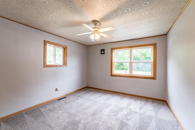 2941 Plover Rd, Wisconsin Rapids, WI 54494 - empty room featuring light carpet, healthy amount of natural light, and a ceiling fan