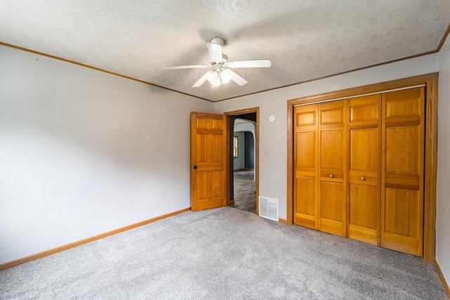 2941 Plover Rd, Wisconsin Rapids, WI 54494 - unfurnished bedroom with carpet floors, a closet, ceiling fan, and ornamental molding