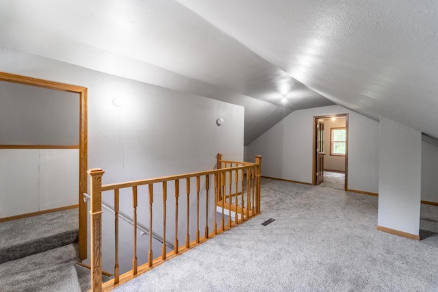 2941 Plover Rd, Wisconsin Rapids, WI 54494 - additional living space featuring carpet flooring and vaulted ceiling