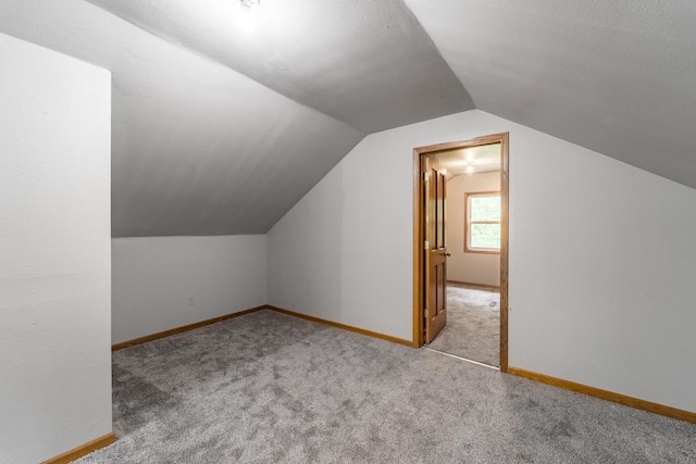 2941 Plover Rd, Wisconsin Rapids, WI 54494 - additional living space featuring lofted ceiling and carpet flooring