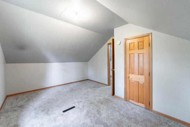 2941 Plover Rd, Wisconsin Rapids, WI 54494 - additional living space featuring carpet and vaulted ceiling