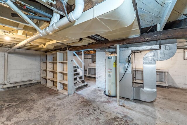 2941 Plover Rd, Wisconsin Rapids, WI 54494 - unfinished below grade area with electric water heater and stairway
