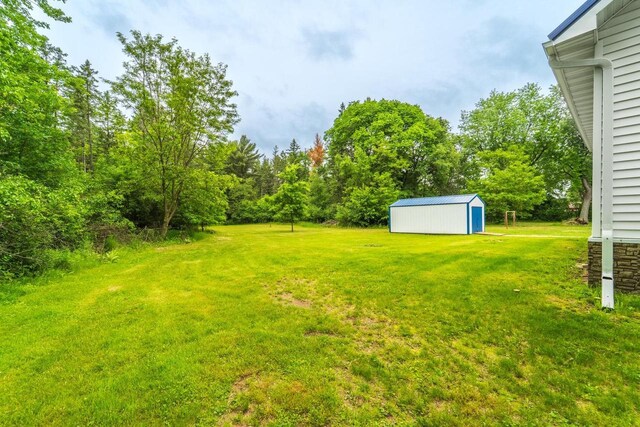 2941 Plover Rd, Wisconsin Rapids, WI 54494 - view of green lawn featuring a storage unit